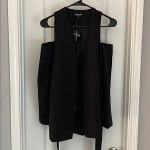 Black blazer with the shoulders out.